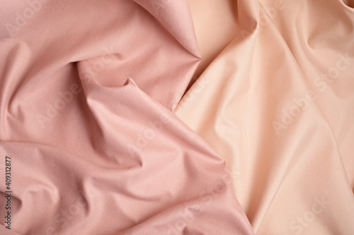 Pink and beige fabric background. Abstract backdrop, luxury cloth