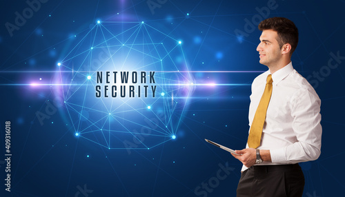 Businessman thinking about security solutions with NETWORK SECURITY inscription