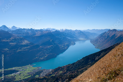 view on the way to Rothorn mountain to the valley and turquoise lake Brienzersee, swiss alps
