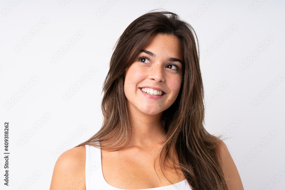 Portrait of pretty teenager Brazilian girl over isolated background Portrait of pretty teenager Brazilian girl over isolated background