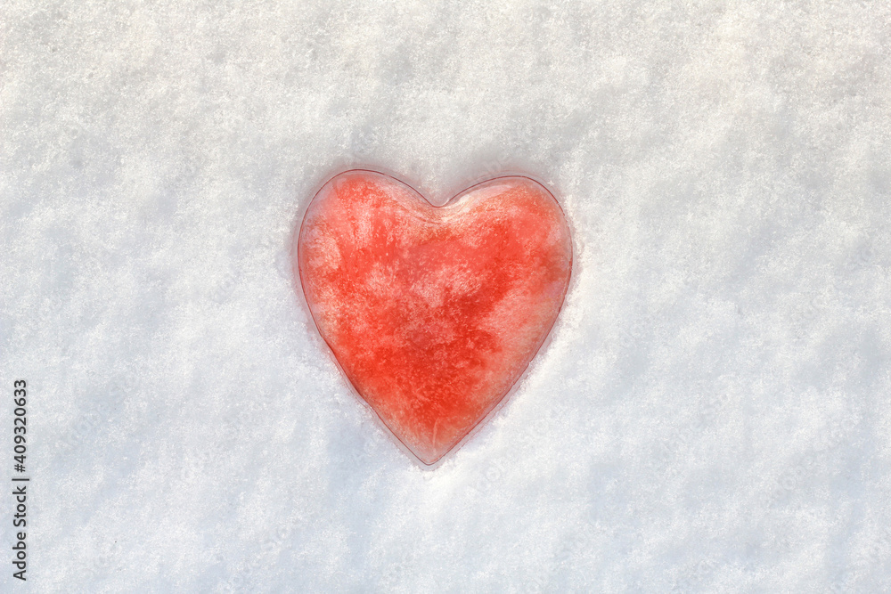 Red heart in the snow. Valentine's Day theme
