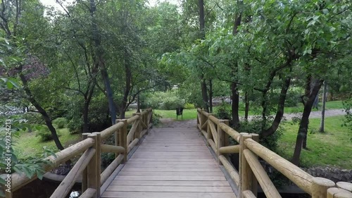 Walking on a wooden bridge at El Retiro park in Madrid