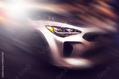 High-speed sports car in motion. Motion blur and abstract background.