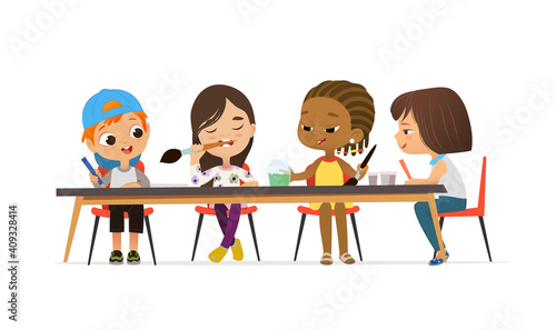 Boys and Girls Draw Pictures with pencils and watercolor paints. Isolated on a White Background. Drawing activity in the art class. Boy and Girl Draw Pictures with paints and pencils.