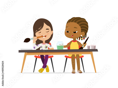 Two Girls Draw Pictures with watercolor paints. Isolated on a White Background. Drawing activity in the art class. African Girl and Caucasian Girl Draw Pictures with paints
