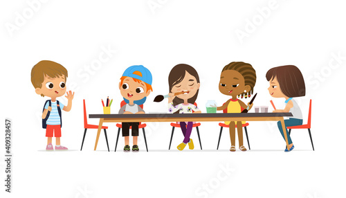 New pupil greeting classmates sitting at table. Boys and Girls draw picture with watercolor and pencils. Drawing activity in the art class. Boy and Girl Draw Pictures with paints and pencils.