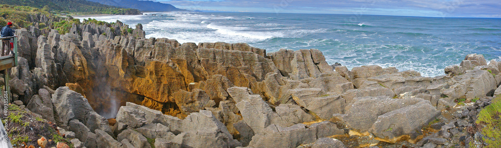 New Zealand Landscape Panorama - Pancake Rocks & Blowholes - Found at Dolomite Point near Punakaiki are a heavily eroded limestone area where the sea bursts through several vertical blowholes.