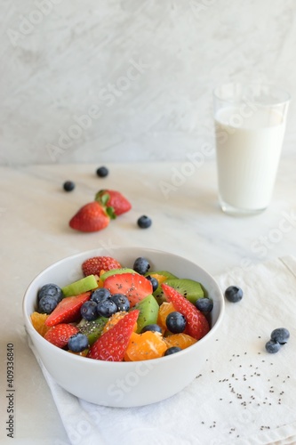 berries and milk, fruit salat, food, milk, healthy, blueberry, rasberry, nutrition, dessert, berry, chia, breakfast, fruit, bowl with fruit, kiwi, apple, orange