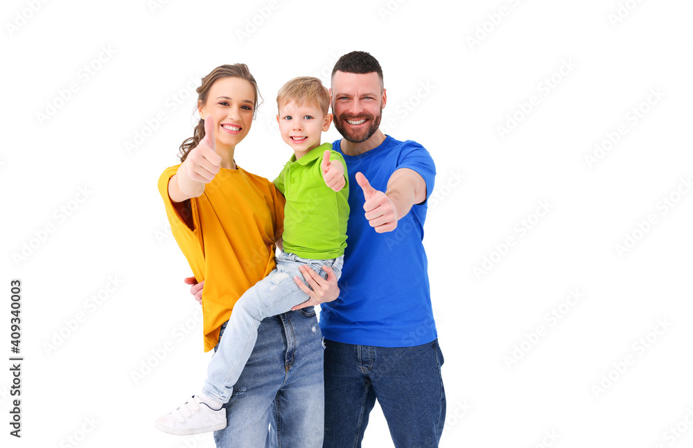 Positive family showing thumbs up at camera in studio Positive family showing thumbs up at camera in studio