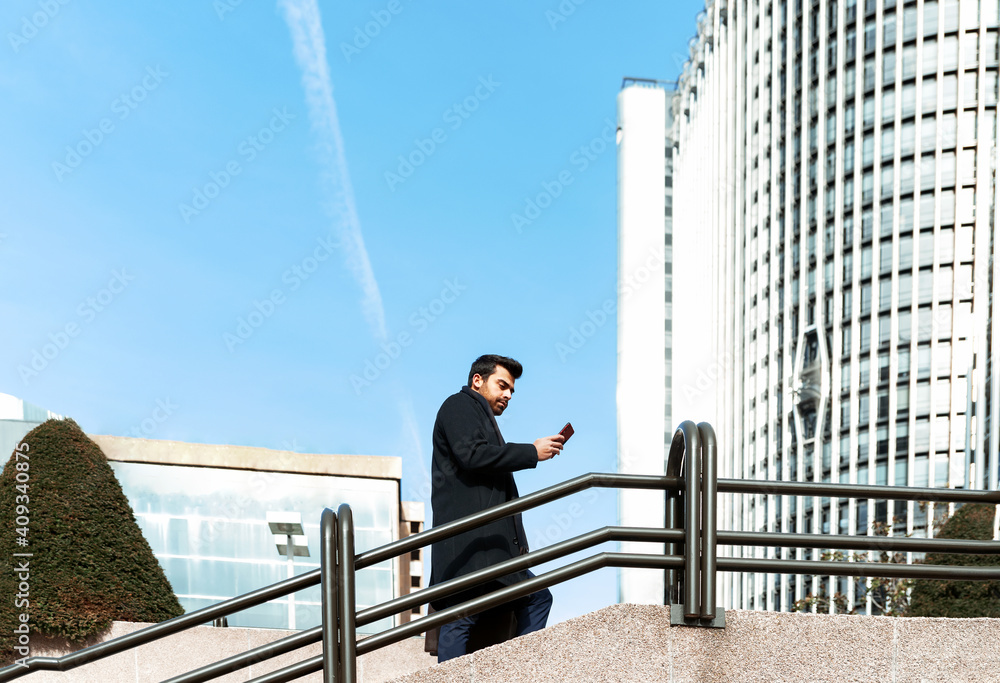 businessman looking at mail from his smart phone businessman looking at mail from his smart phone