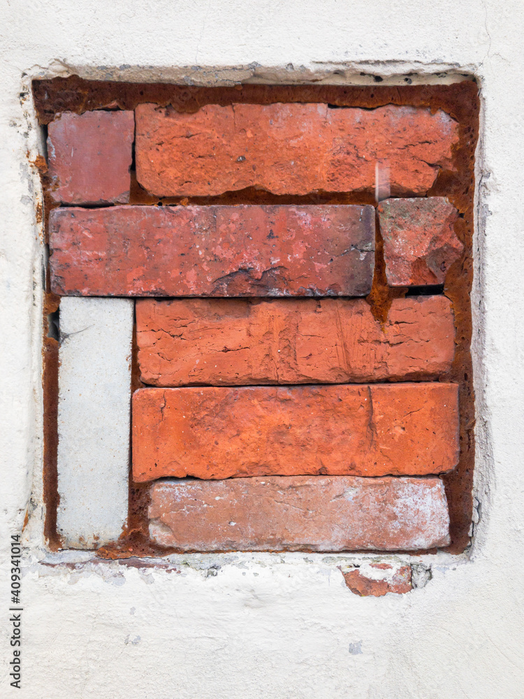 red bricks stack in a old square shape window red bricks stack in a old square shape window