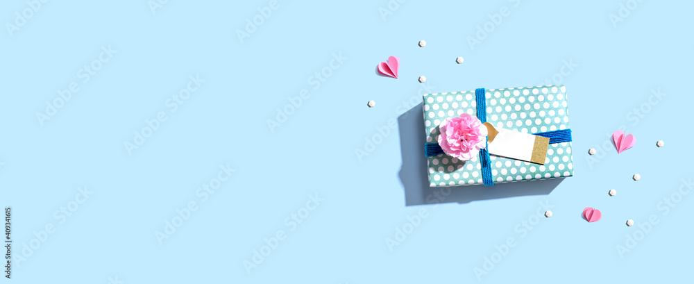 Appreciation theme with a gift box and a pink carnation flower