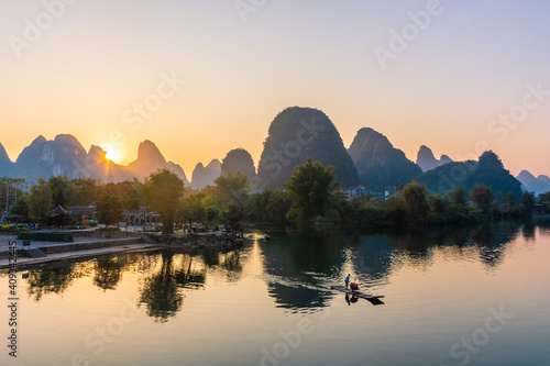YANGSHUO, CHINA, 6 DECEMBER 2019: Beautiful sunset on the Yulong River in Yangshuo, Guilin, Guangxi