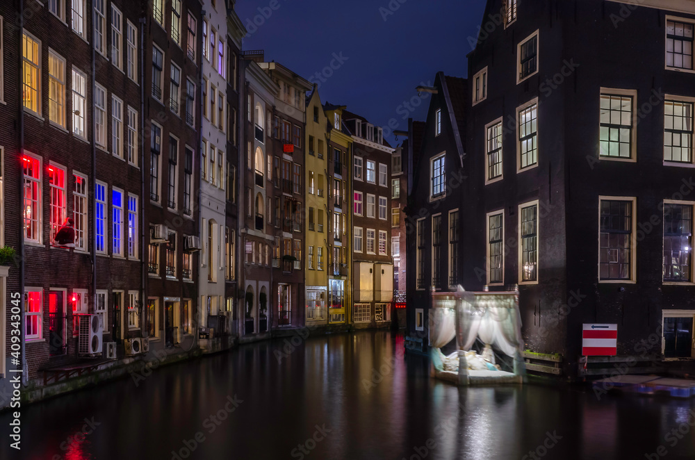 Amsterdam is one of the coolest places in the world. This image was taken just outside the famous redlight district and is such an interesting scene with the floating bed on the canals.