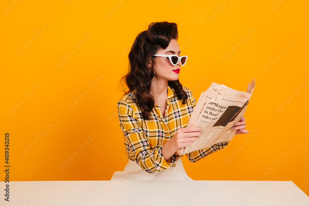 Elegant Young Woman Reading Newspaper Studio Shot Of Concentrated Pinup Girl Posing On Yellow Background Stock Photo Adobe Stock