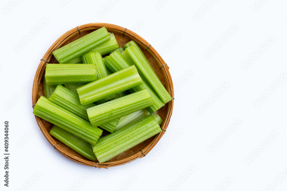 Fresh celery in wooden basket on white background. Copy space Fresh celery in wooden basket on white background. Copy space