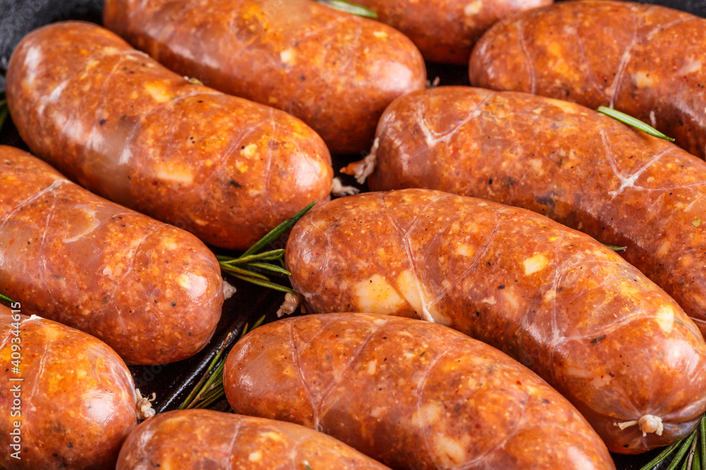 Grilled sausages, homemade,cast iron skillet or frying pan with tomatoes, garlic and rosemary. Brazilian barbecue. copy space Grilled sausages, homemade,cast iron skillet or frying pan with tomatoes, garlic and rosemary. Brazilian barbecue. copy space