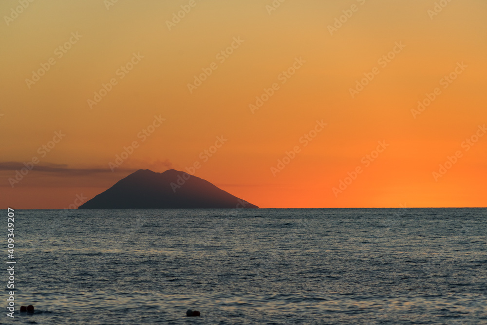 Beautiful sunset over Tyrrhenian Sea and Stromboli island viewed from Tropea, Calabria, Italy