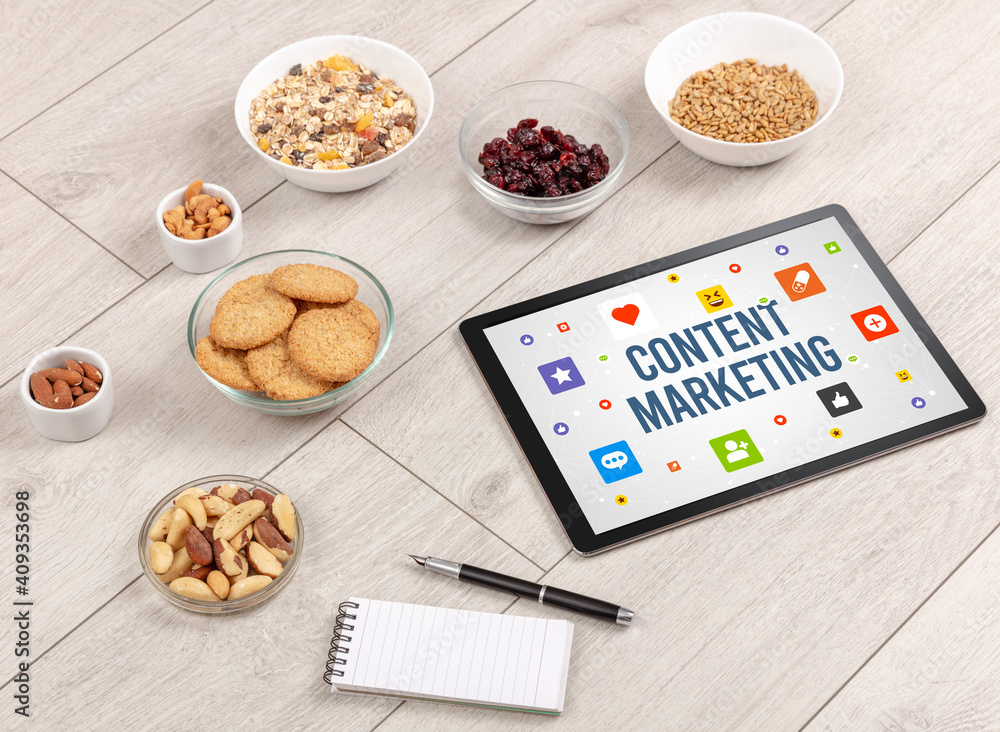 Healthy Tablet Pc compostion with CONTENT MARKETING inscription, Social networking concept Healthy Tablet Pc compostion with CONTENT MARKETING inscription, Social networking concept