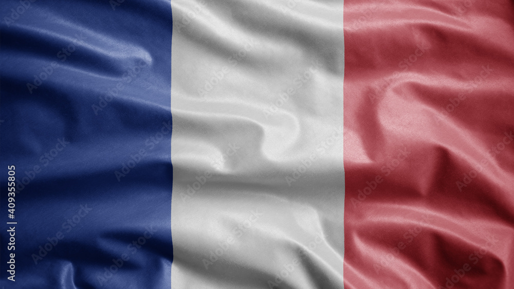 Obraz premium French flag waving in the wind. Close up of France banner blowing, soft silk.