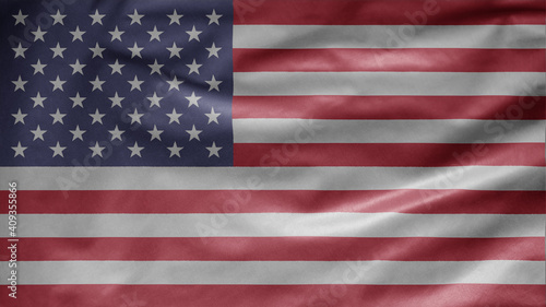 American flag waving in the wind. Close up of USA banner blowing, soft silk.