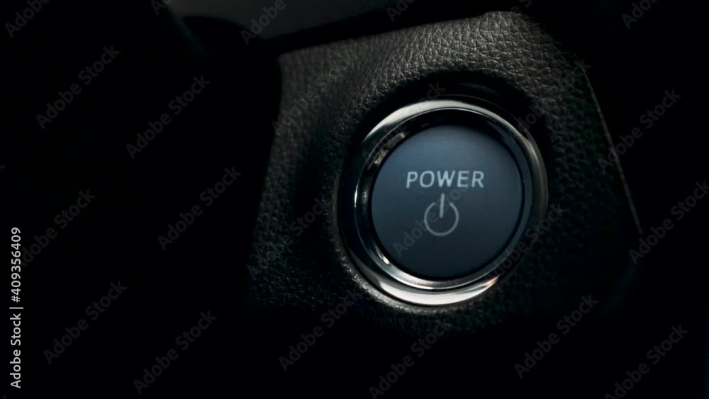pushing blue Power ignition Button to start keyless ignition hybrid car