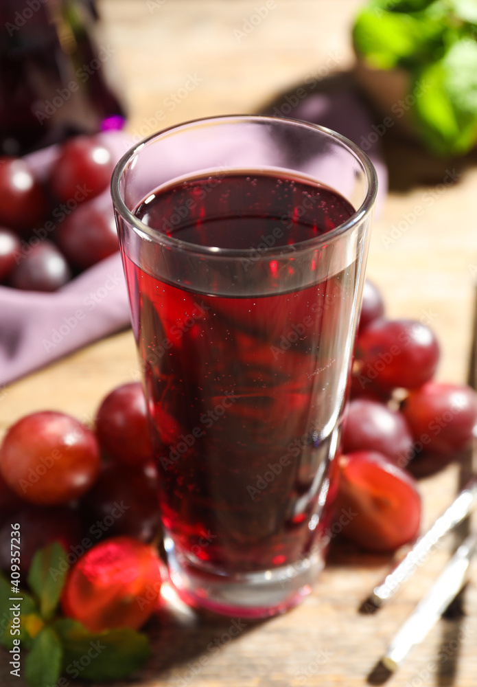 Delicious grape soda water on table. Refreshing drink Delicious grape soda water on table. Refreshing drink