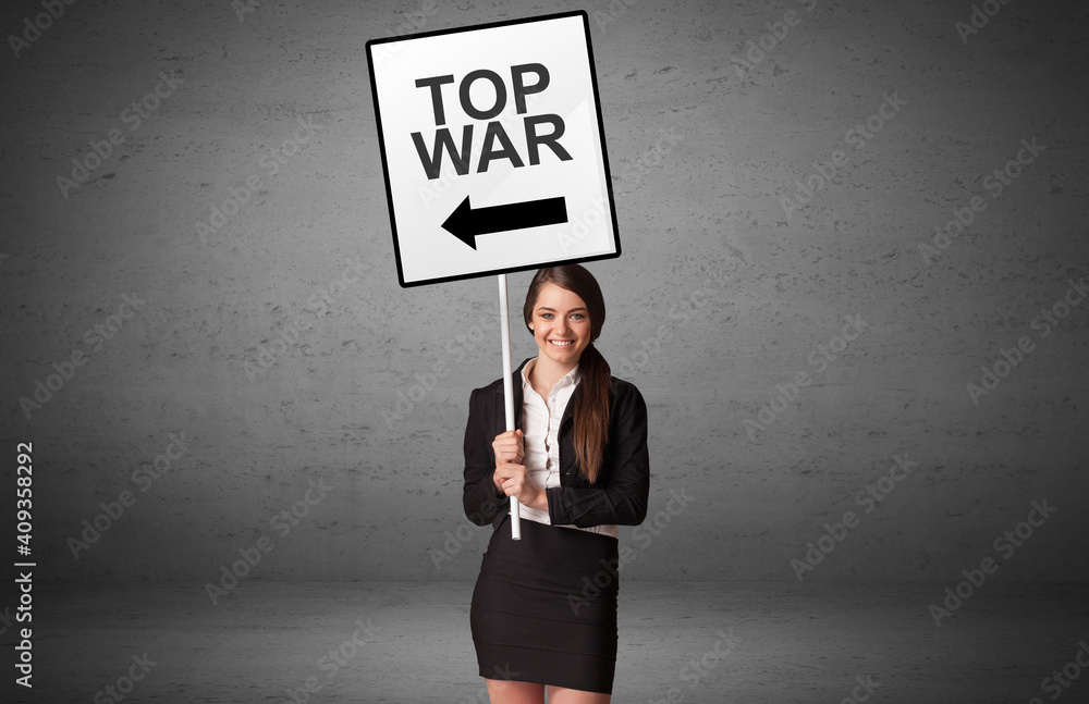 business person holding a traffic sign with TOP WAR inscription, new idea concept business person holding a traffic sign with TOP WAR inscription, new idea concept