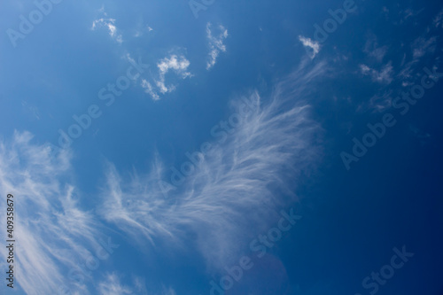 High white wispy cirrus clouds with cirro-stratus in the blue Australian sky sometimes called mare's tails indicate fine weather now but stormy changes coming within a couple of days.