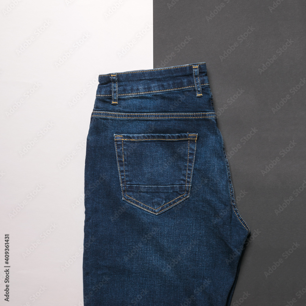 Dark men's jeans on a black and white background. Dark men's jeans on a black and white background.