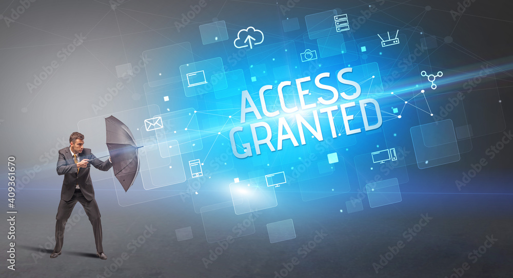 Businessman defending with umbrella from cyber attack and ACCESS GRANTED inscription, online security concept Businessman defending with umbrella from cyber attack and ACCESS GRANTED inscription, online security concept