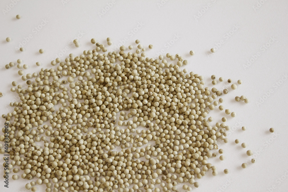 white peppers on the white background. white peppers on the white background.