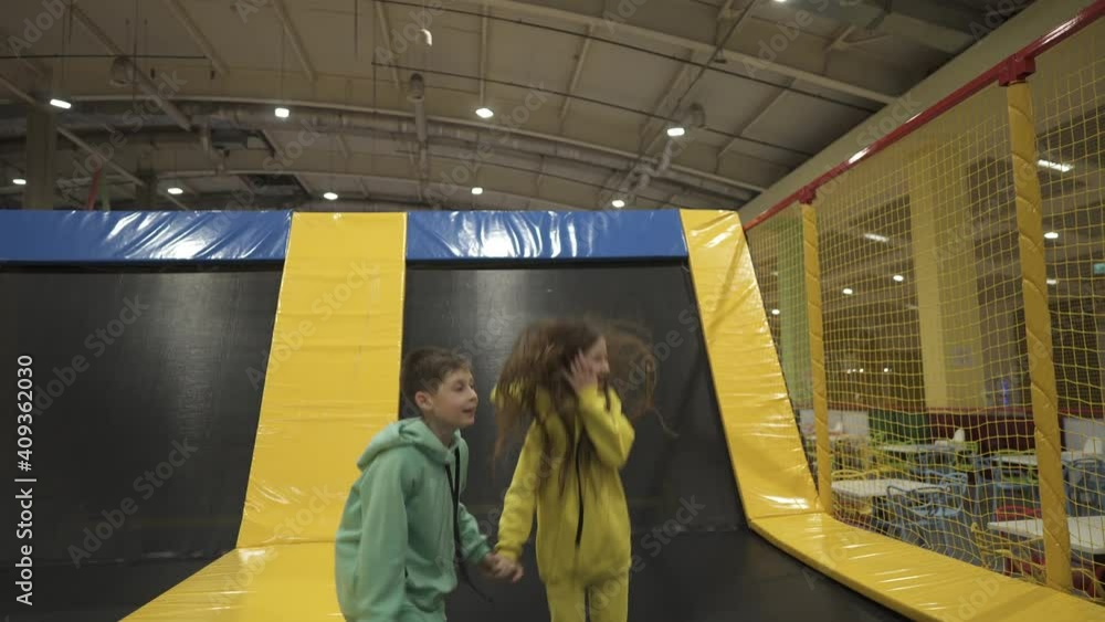 Active leisure. Children having fun on trampoline in entertainment
