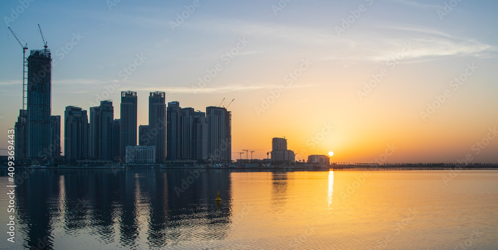 Dubai, UAE - 01.29.202 Sunrise over Dubai city skyline. Creek Harbor by EMAAR. Outdoors