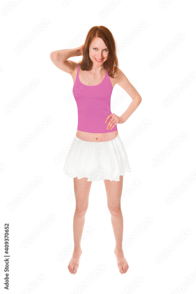 Full length portrait of an attractive laughing woman wearing a white miniskirt and a pink tank top, isolated on white studio background Full length portrait of an attractive laughing woman wearing a white miniskirt and a pink tank top, isolated on white studio background
