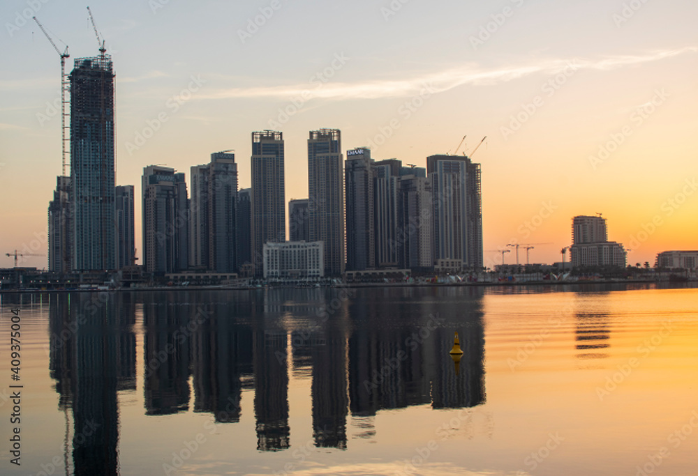 Dubai, UAE - 01.29.202 Sunrise over Dubai city skyline. Creek Harbor by EMAAR. Outdoors