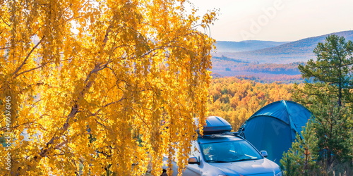 a large camping tent stands against the backdrop of the Ural ridge Nurali. Bashkortostan. photo