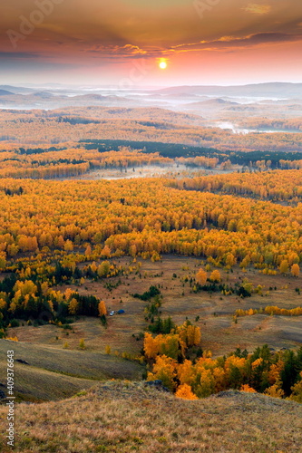 dawn meeting in the Ural mountains from the Nurali ridge in an autumn morning. photo