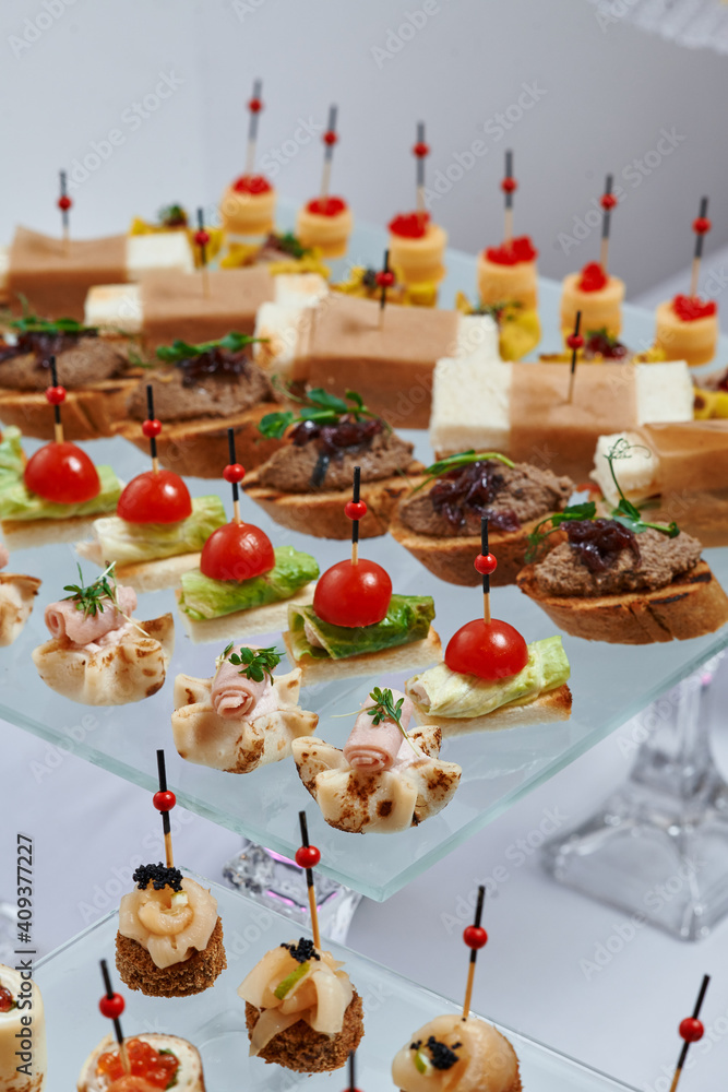 Сatering. Banquet table with different snacks and desserts