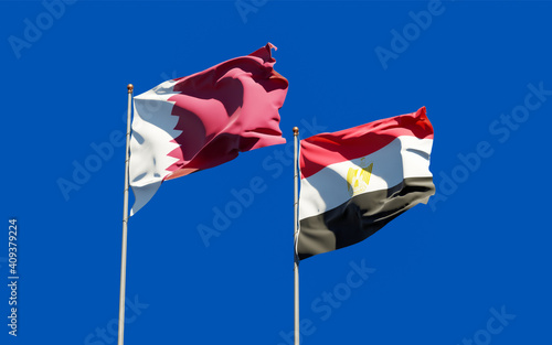 Flags of Qatar and Egypt.