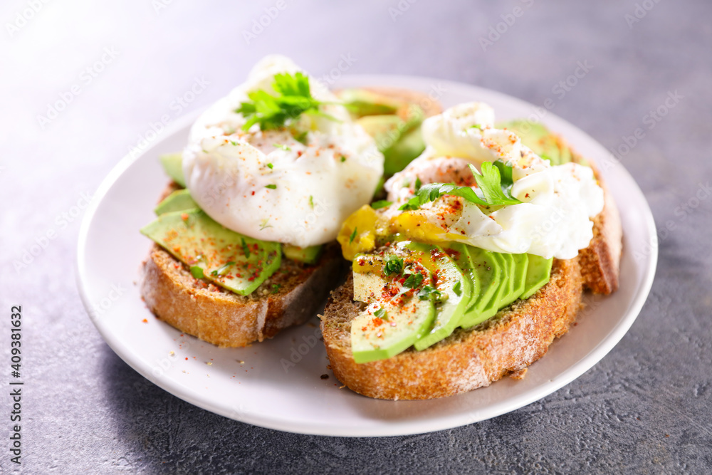 bread sliced with avocado and poached egg