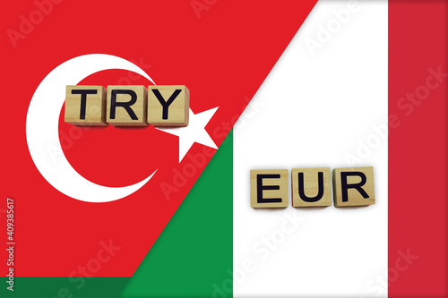 Turkey and Italy currencies codes on national flags background © andreyakaan147