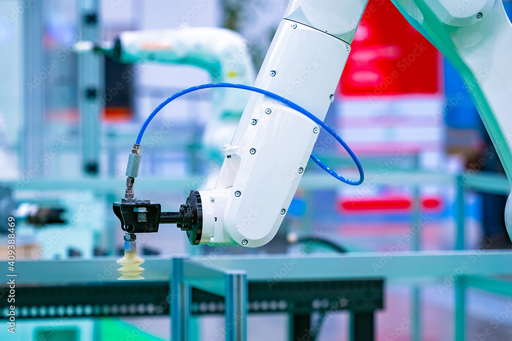 Industrial robot. Robotics. Production automation. Programming devices for  use in the factory floor. The white arm of a robotic arm. Machines replace  people in production. foto de Stock | Adobe Stock