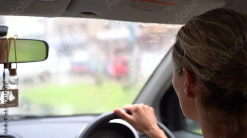 Wallpaper Mural Young woman driving a car during the rain, close up. Island of Zanzibar, Tanzania, East Africa, slow motion Torontodigital.ca