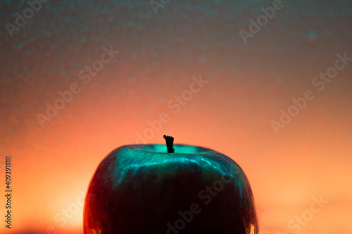 red apple on the sunset