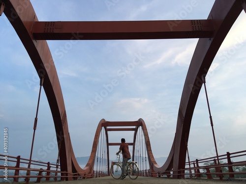 Cycling with a View of the Red Bridge
