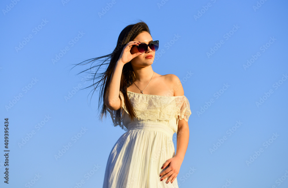 Female psychology. Beautiful woman on sunny day blue sky. Summer fashion. Girl in sunglasses copy space. Towards summer. Wind of change. Fancy model in tender summer dress. Freedom and Harmony Female psychology. Beautiful woman on sunny day blue sky. Summer fashion. Girl in sunglasses copy space. Towards summer. Wind of change. Fancy model in tender summer dress. Freedom and Harmony