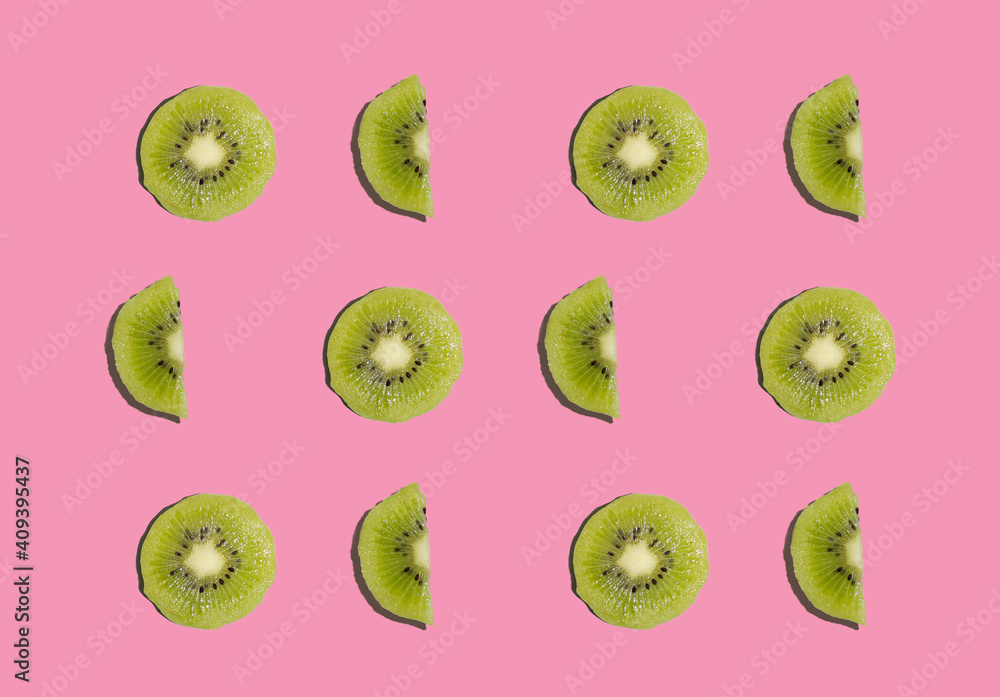 Fototapeta premium Kiwi isolated on pink background. Half of kiwi. Kiwi pattern. Food photography.
