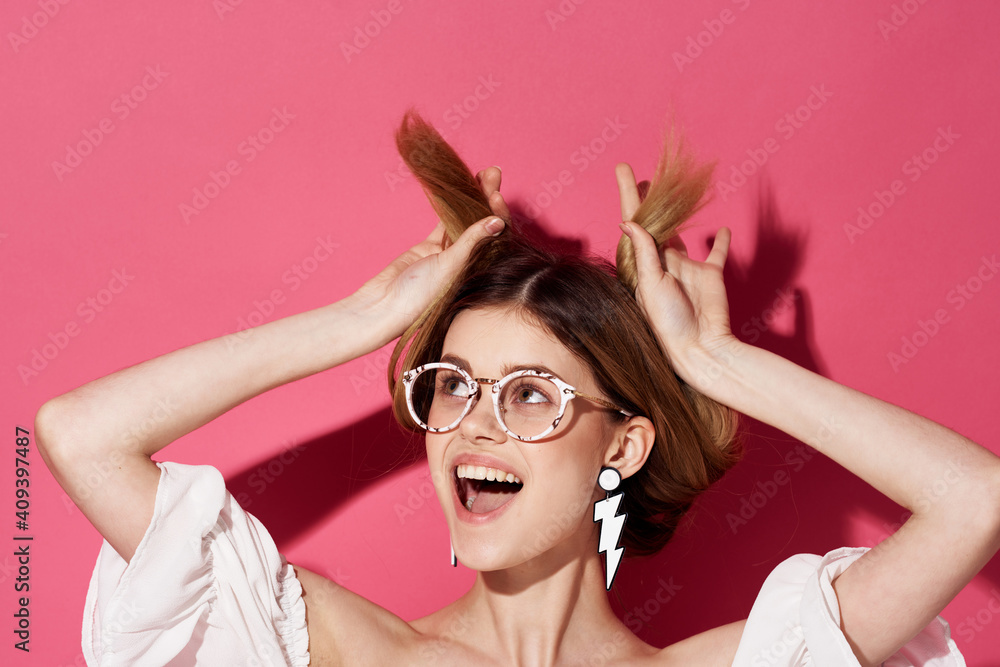 Cheerful pretty woman earrings jewelry attractive look fashion pink glamor background Cheerful pretty woman earrings jewelry attractive look fashion pink glamor background