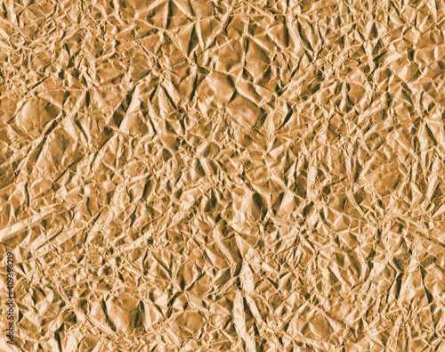 Crumpled gold foil texture background
